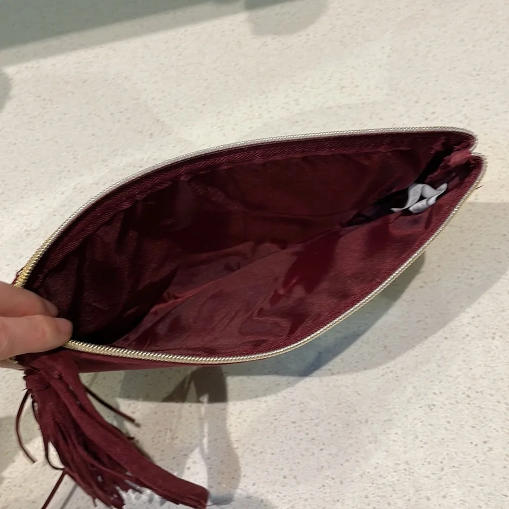 Kit & Luc maroon gold suede tassel zip cosmetics bag